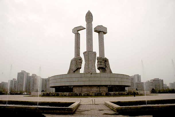 The monument to the Party. The hammer represents the workers, the sickle the peasants, and the brush the intellectuals.
