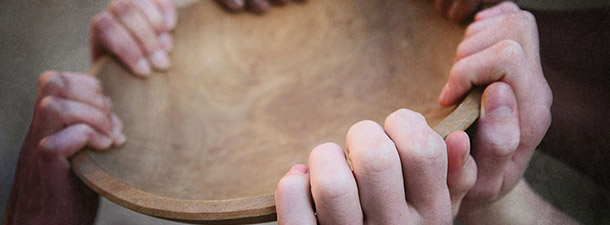 Hands holding bowl