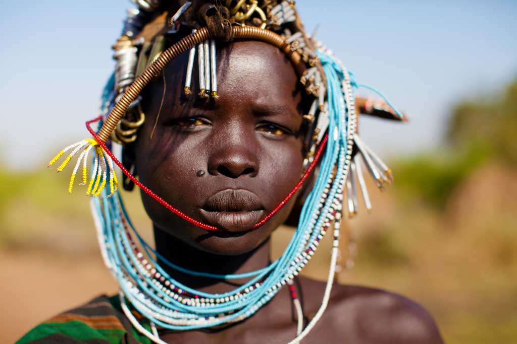 Mursi-woman--in-head-dress