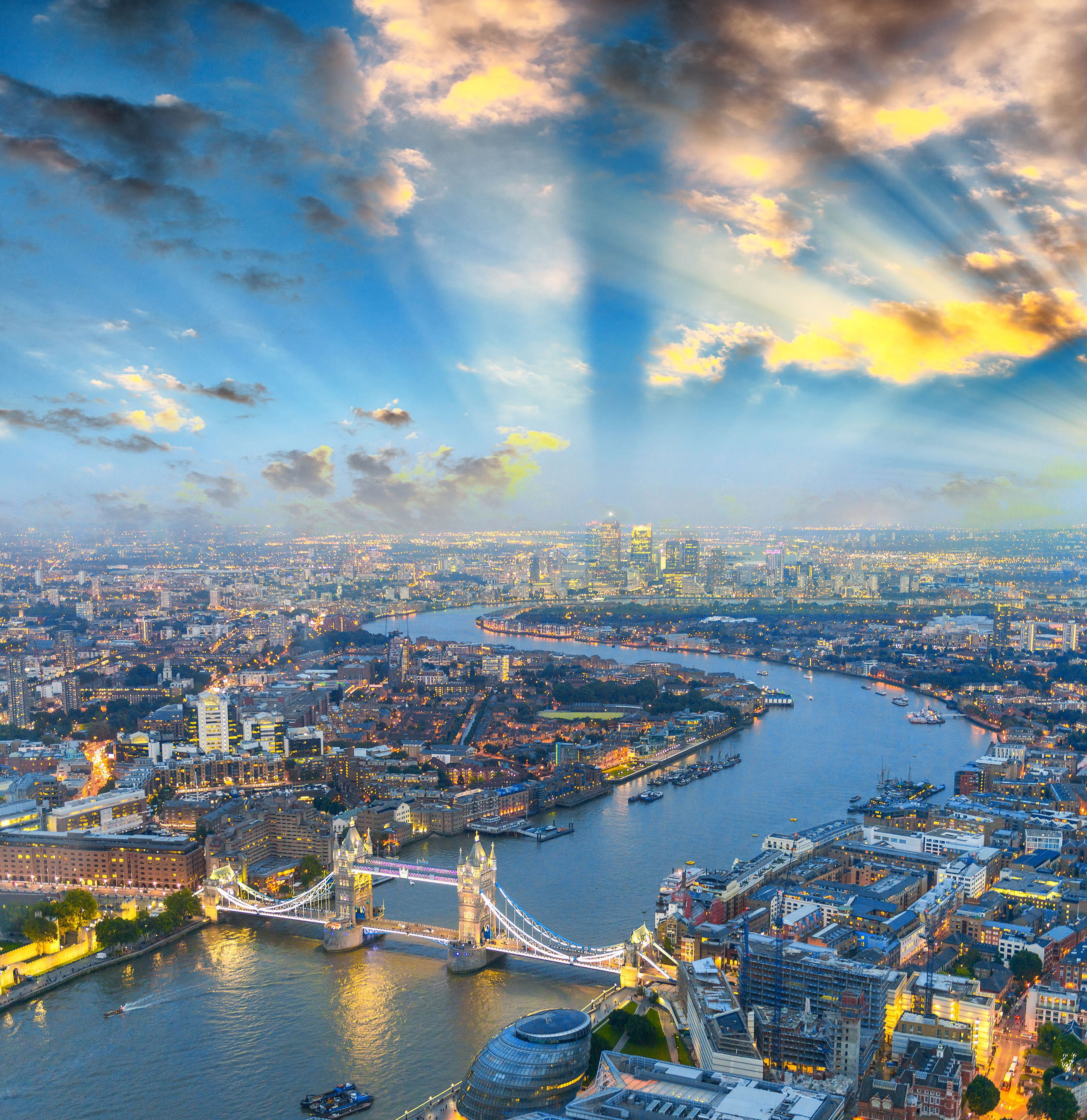 London at night. Aerial view of Tower Bridge area and city lights.