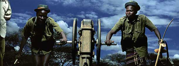 Courtesy of Alejandro Chaskielberg, Oxfam and Michael Happen Gallery Portrait of Napva Kaanvang and Losike. Kangwira collecting water for local women. Turkana Series 2011