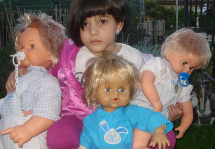 Girl with Cicciobello dolls