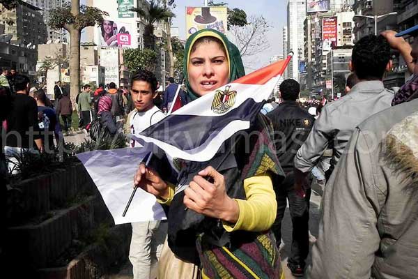 Woman holding Egyptian flag