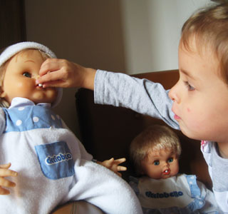 Girl with Cicciobello dolls