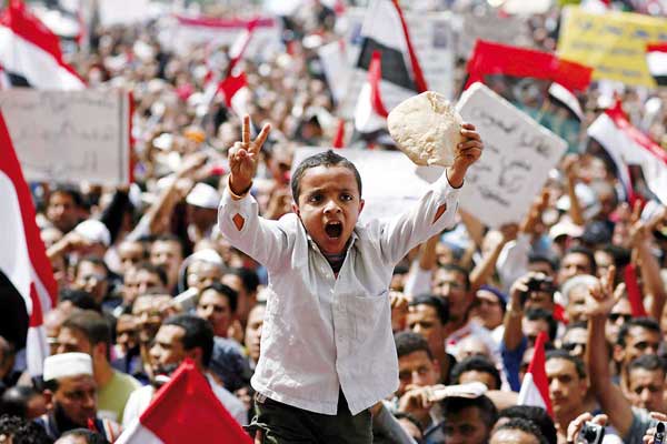 Boy with bread during Egyptian political revolution